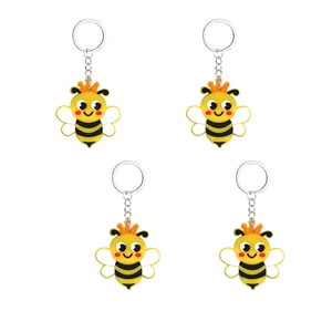 Set di quattro simpatici portachiavi a forma di ape con corone arancioni su sfondo bianco