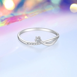 Elegant S925 sterling silver ring with a central round diamond and pavé side stones