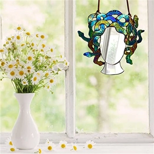 Detailed view of Medusa suncatcher with colorful acrylic snakes and a mirror center