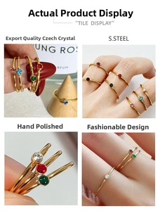 Detailed macro view of gold plated stainless steel rings with colorful zircon crystals