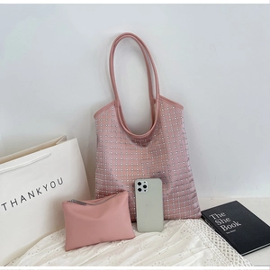 Detailed set of pink tote bag with rhinestone grid pattern and matching inner pouch
