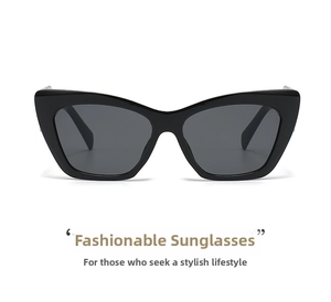 Detail view of large square cat eye sunglasses with thick black frame and dark grey lenses