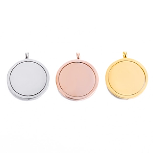 Rotating stainless steel round pendant in silver, rose gold, and gold finishes