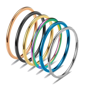 Minimalist 4mm stainless steel rings set in six metallic colors on white background