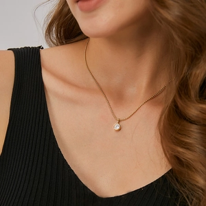 Minimalist gold necklace for women featuring a single round zircon on a delicate bead chain