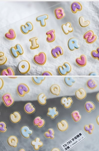 Macro detail of 5D embossed alphabet and star nail stickers in macaron colors TS-785