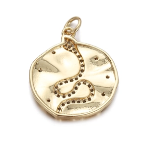Macro shot of gold snake-shaped round pendant with micro-inlaid sparkling zircon details