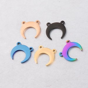 Detail of 14x15mm crescent moon pendants in five finishes with dual hanging holes