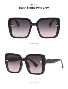 Detail of oversized black square sunglasses with pink grey lenses and gold metal M logo