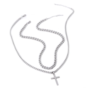Detail of silver double-layered cuban chains and cross pendant in stainless steel
