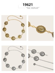 Detailed view of vintage embossed oval metal discs on bohemian gold and silver chain belts