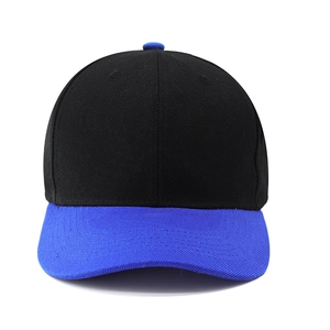 Detail view of a two-tone black and blue baseball cap with structured panels and curved brim