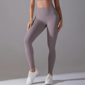 Close-up of high-waisted seamless yoga leggings in pale lilac with tummy control