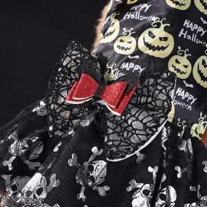 Halloween pet dress featuring pumpkin prints, skull tulle, and a glittery bow detail