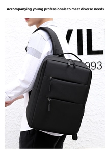 Rear view of model wearing black waterproof business laptop backpack with padded straps