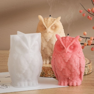 Macro shot of 3D owl silicone mold and finished resin candles showing feather texture