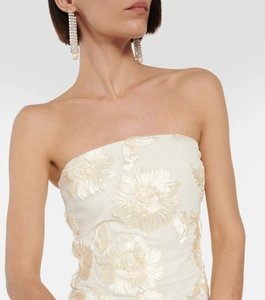 Detailed embroidery of 3D large flowers on the white strapless fishtail evening gown