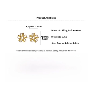 Detail showing 2.5cm gold-plated floral earrings with rhinestones and silver pins