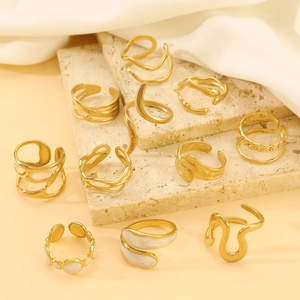 Minimalist liquid geometric irregular gold open rings set with white drip oil accents