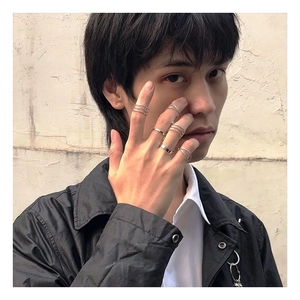 Close-up of a 6-piece silver alloy street style ring set worn by a fashion model