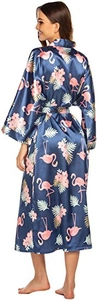 Detail of navy blue satin robe featuring pink flamingo and green palm leaf prints