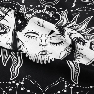 Detail showing high-quality black and white polyester tapestry with sun and moon patterns