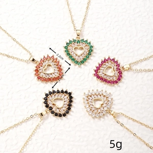 Macro view of heart pendant necklaces in five vibrant colors with crystal embellishments