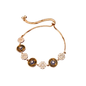 French vintage 18k gold-plated evil eye bracelet with starburst charms and sliding clasp
