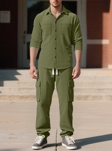 Close-up of olive green corduroy texture on men's shirt and cargo pants utility set