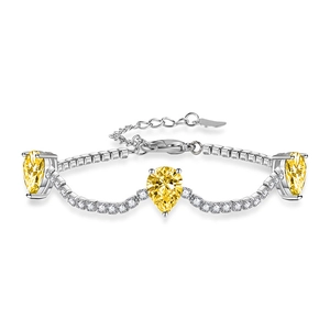 Elegant silver bracelet featuring pear-cut yellow gemstones and sparkling accents