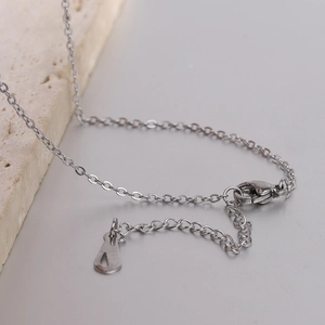 Macro view of stainless steel O-chain necklace with lobster clasp and adjustable link