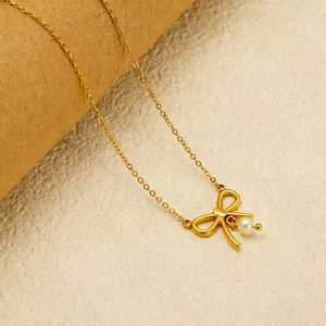 French bow necklace with 18K gold plating and a white round pearl pendant