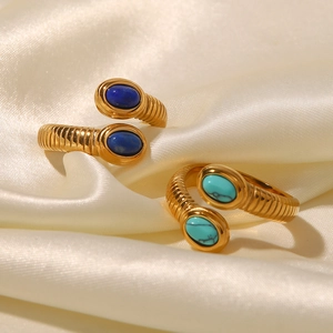 18K gold plated snake rings with lapis lazuli and turquoise on beige silk fabric