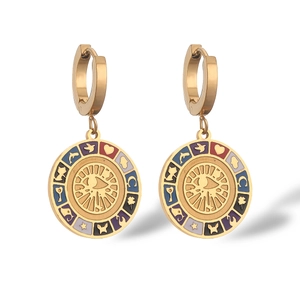 Bohemian gold hoop earrings with colorful enamel charms featuring sun and moon symbols