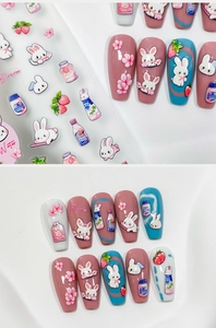 Detail von Cartoon-Häschen und Kirschblüten-Nagelaufklebern mit 3D-Relief-Effekt
