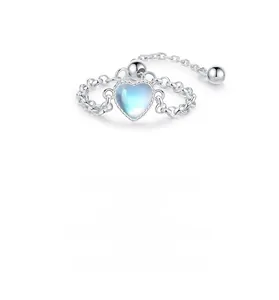 Detail of S925 silver adjustable chain ring featuring a heart moonstone with blue fire