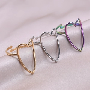 Adjustable hollow heart-shaped rings in gold, silver, and rainbow steel finishes