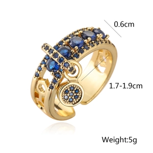 Detail view of gold-plated ring with blue zircons showing width 0.6cm and inner diameter
