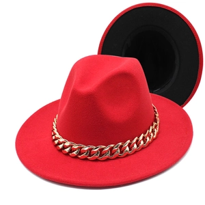 Two-tone red fedora hat with a bold gold acrylic chain and minimalist felt texture