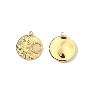 Detail of gold stainless steel sun moon charms with inlaid beige stones for DIY jewelry