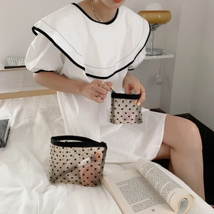 Detail of transparent mesh makeup bags with black heart patterns in multiple sizes