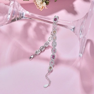 Close-up of S925 silver tennis bracelet with colorful oval zircons on glass