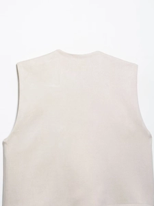 Close-up detail of beige sleeveless vest showing premium brushed texture and neckline