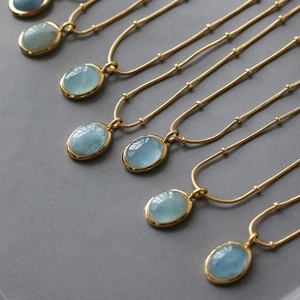 18K gold plated stainless steel necklace with oval light blue natural stone pendants