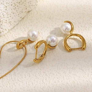 Detailed macro view of 18K gold plated pearl necklace and matching earrings set