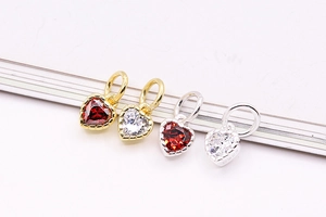 Macro shot of S925 sterling silver heart pendants with red and white zircons for DIY jewelry