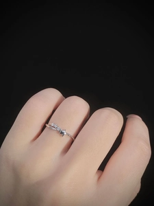Close-up of S925 sterling silver star ring with micro-set zircon on woman finger