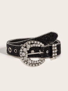 Detailed macro view of black rhinestone belt with sparkling fabric and round buckle