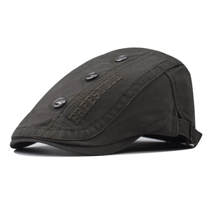 Detail of Freestyle embroidery and metal buckle on camo duckbill flat cap
