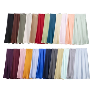 Detail showing 24 color options of elegant satin midi skirts with smooth silky texture